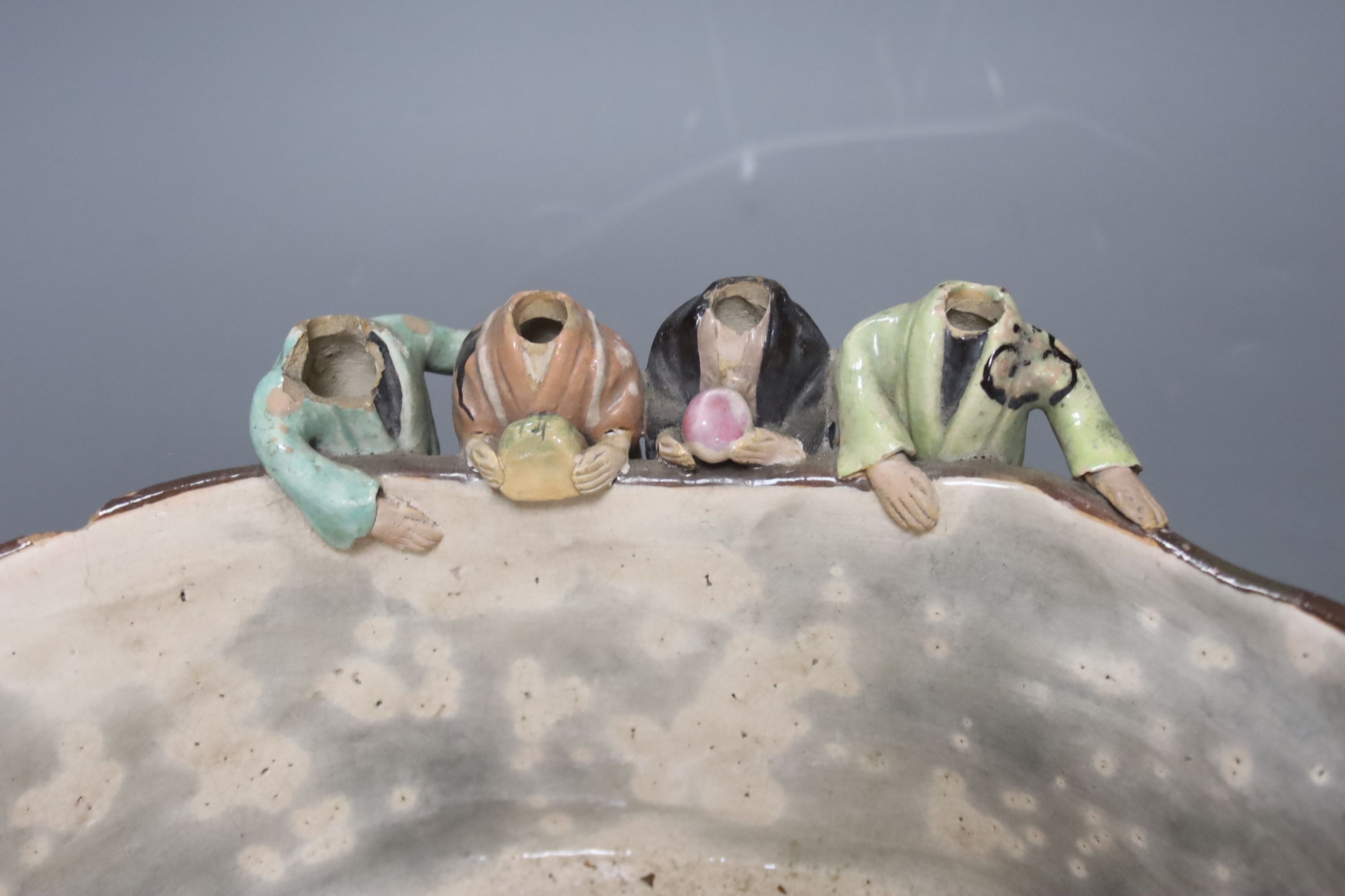 An unusual Japanese Sumida style pottery bowl, figures with detaching heads, diameter 32cm